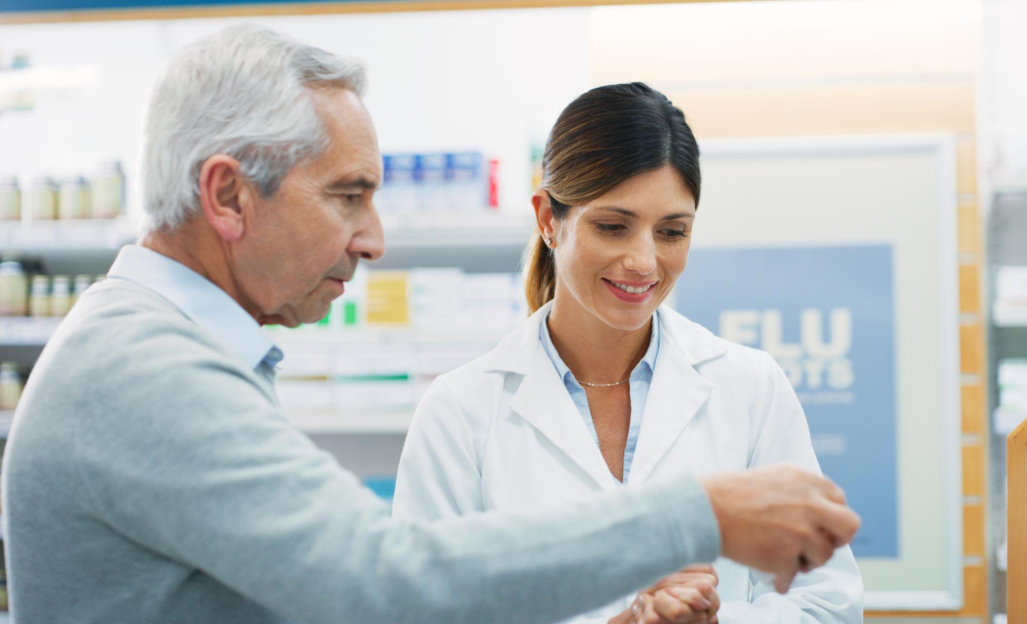 pharmacy product senior customer woman advice recommendation consulting about pills medicine package